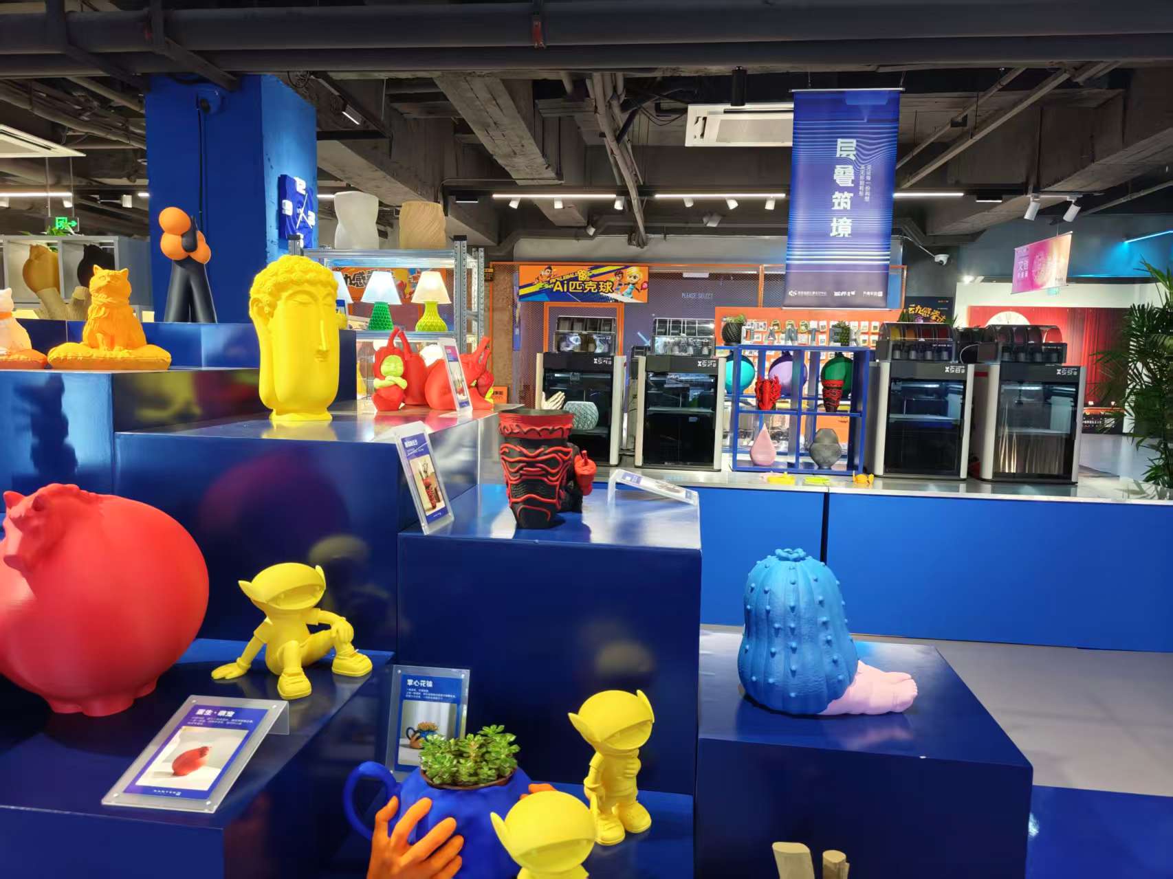 PalXAI exhibition booth and 3D printers